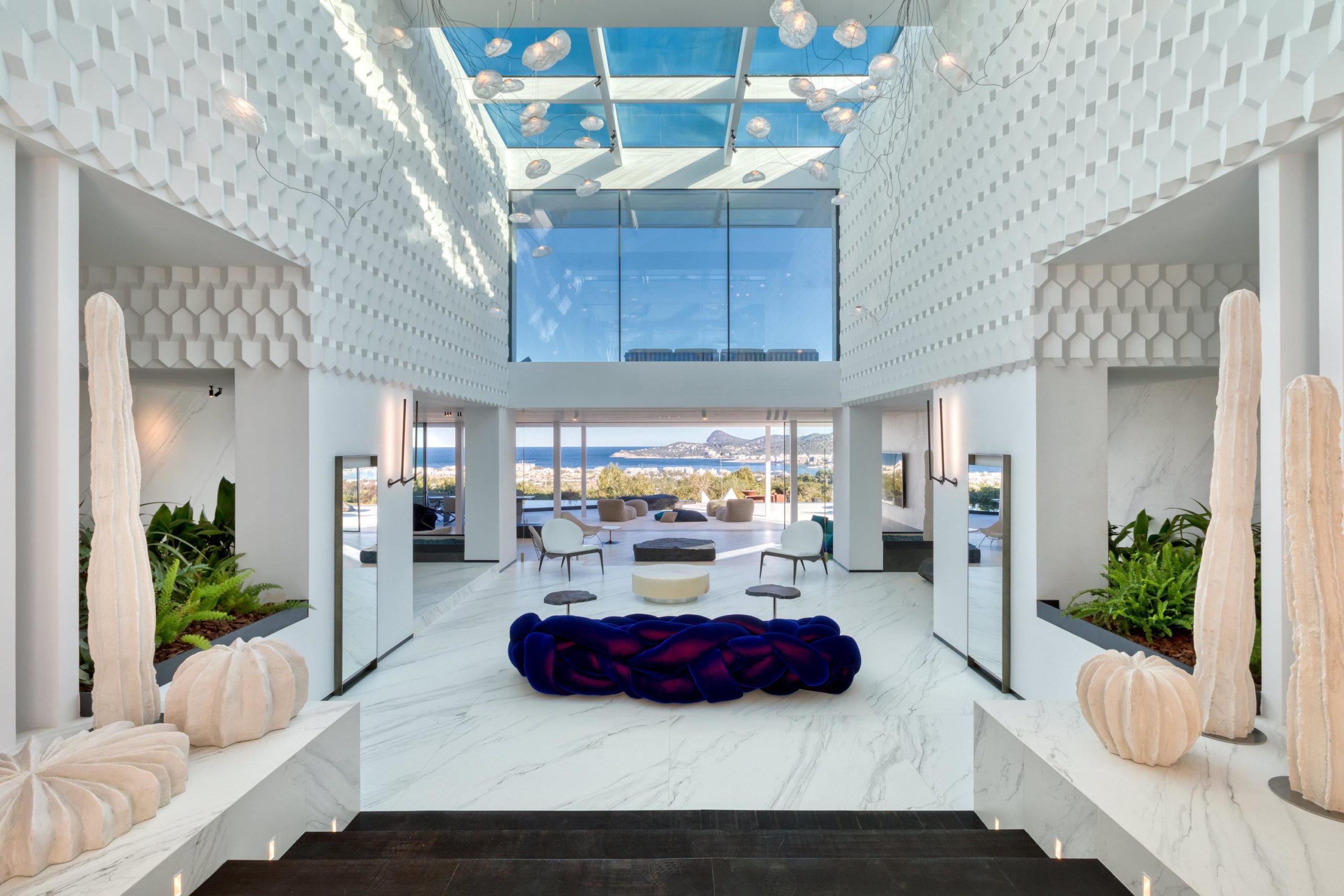 Grand modern entrance hall with natural light and luxury Mediterranean architecture at Villa Forest Ibiza