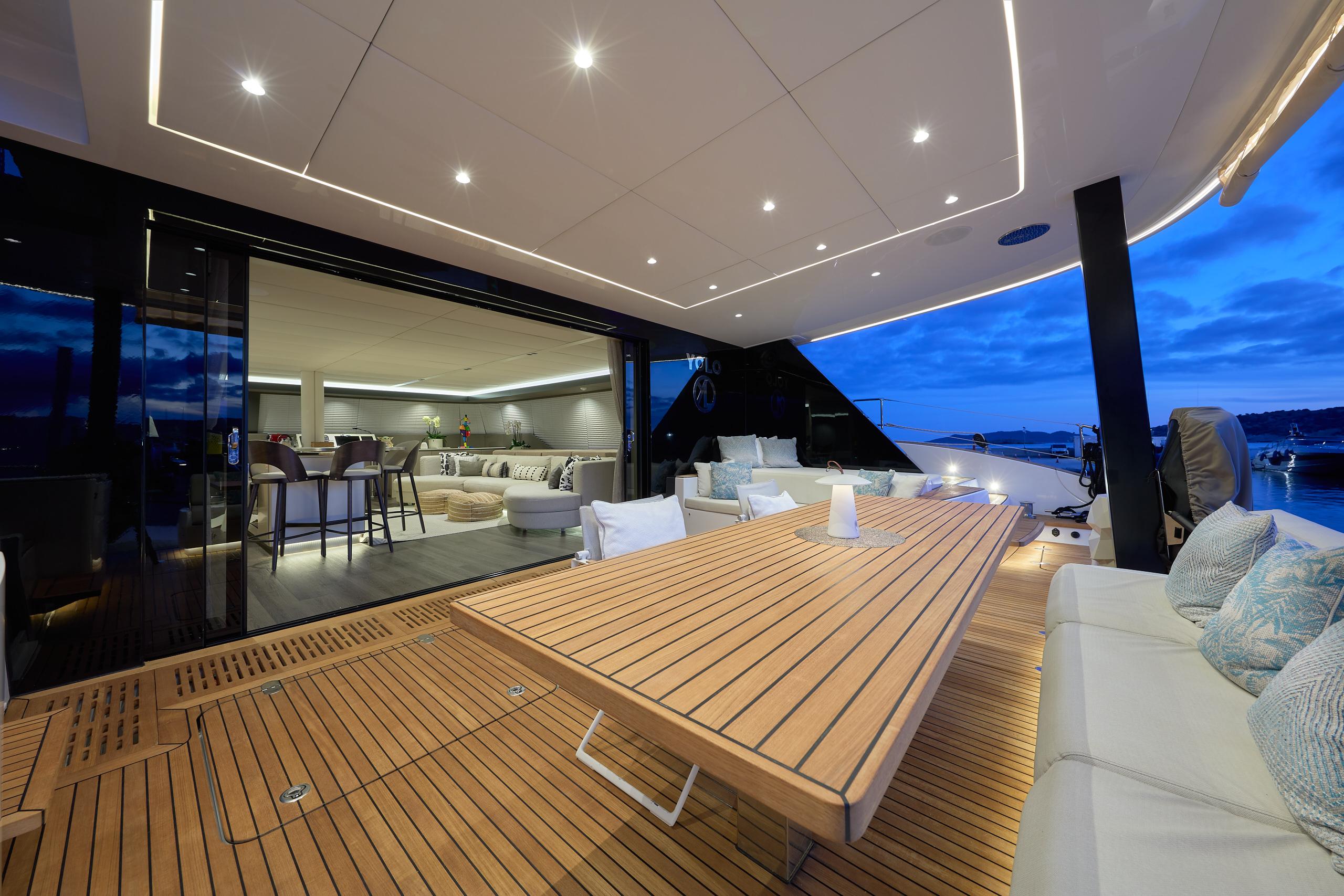 Contemporary aft deck with panoramic Ibiza views aboard Sunreef 70+