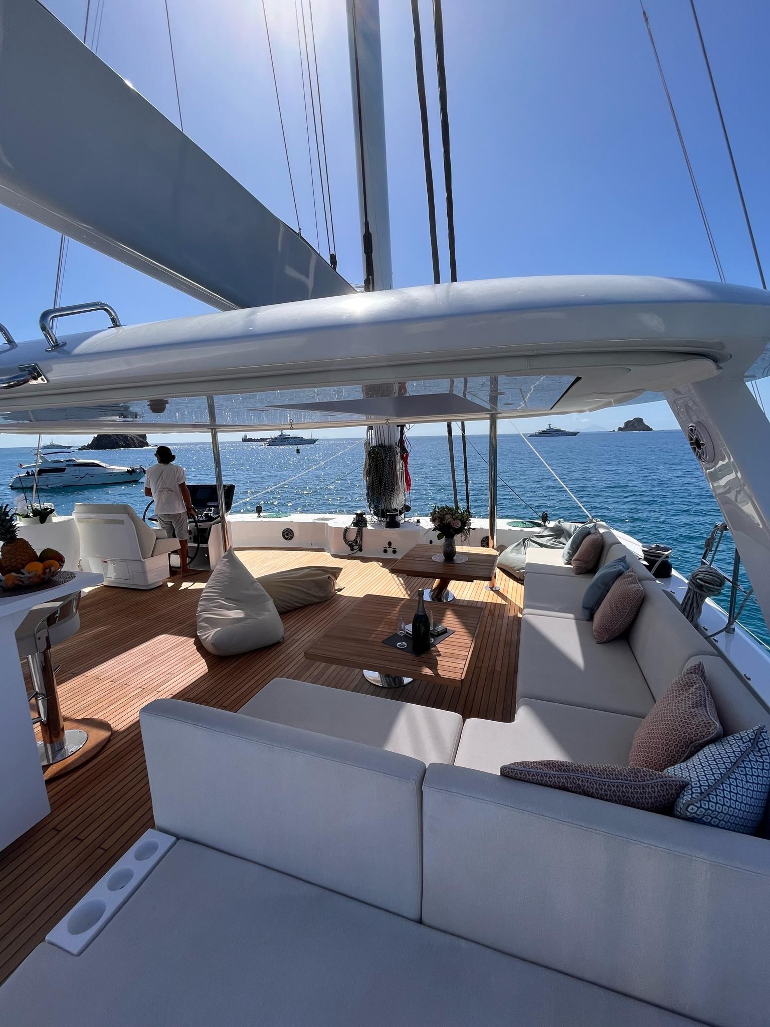 Flybridge lounge with Mediterranean sea views aboard Sunreef 70+