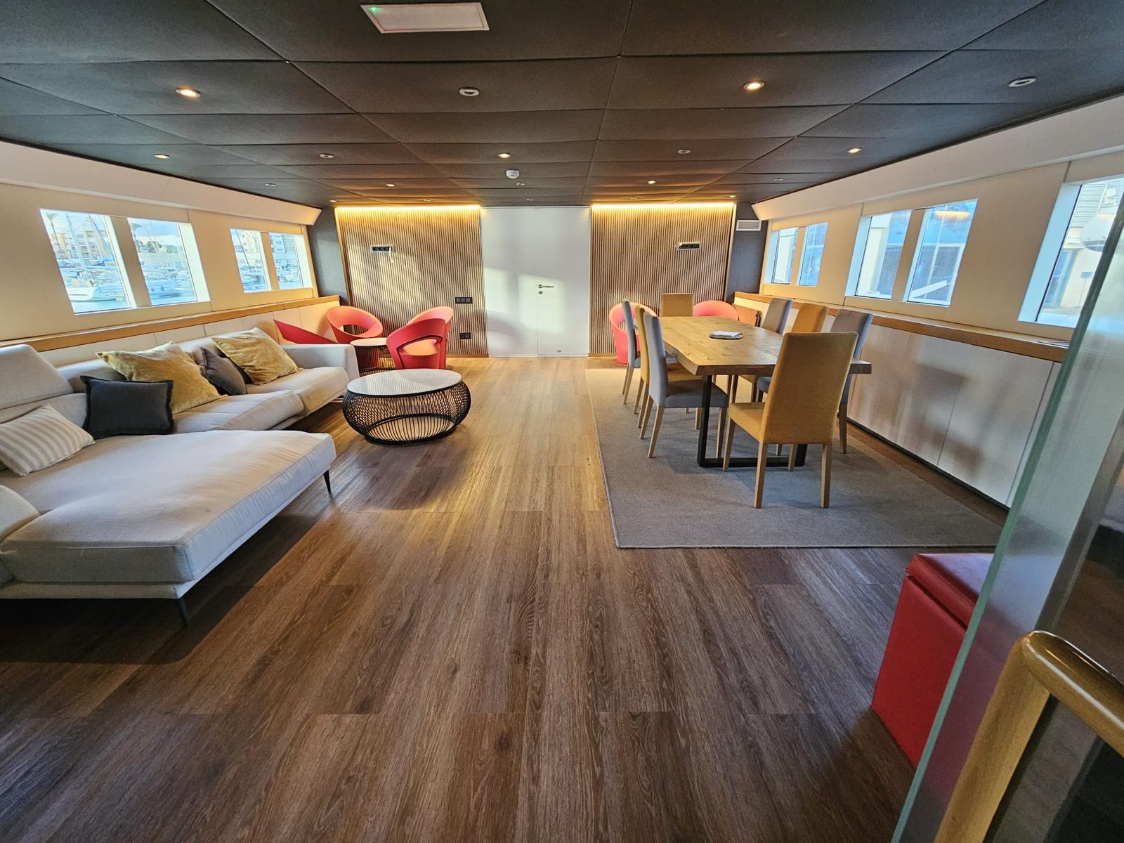 Contemporary indoor lounge and dining area inside Explorer 92 yacht