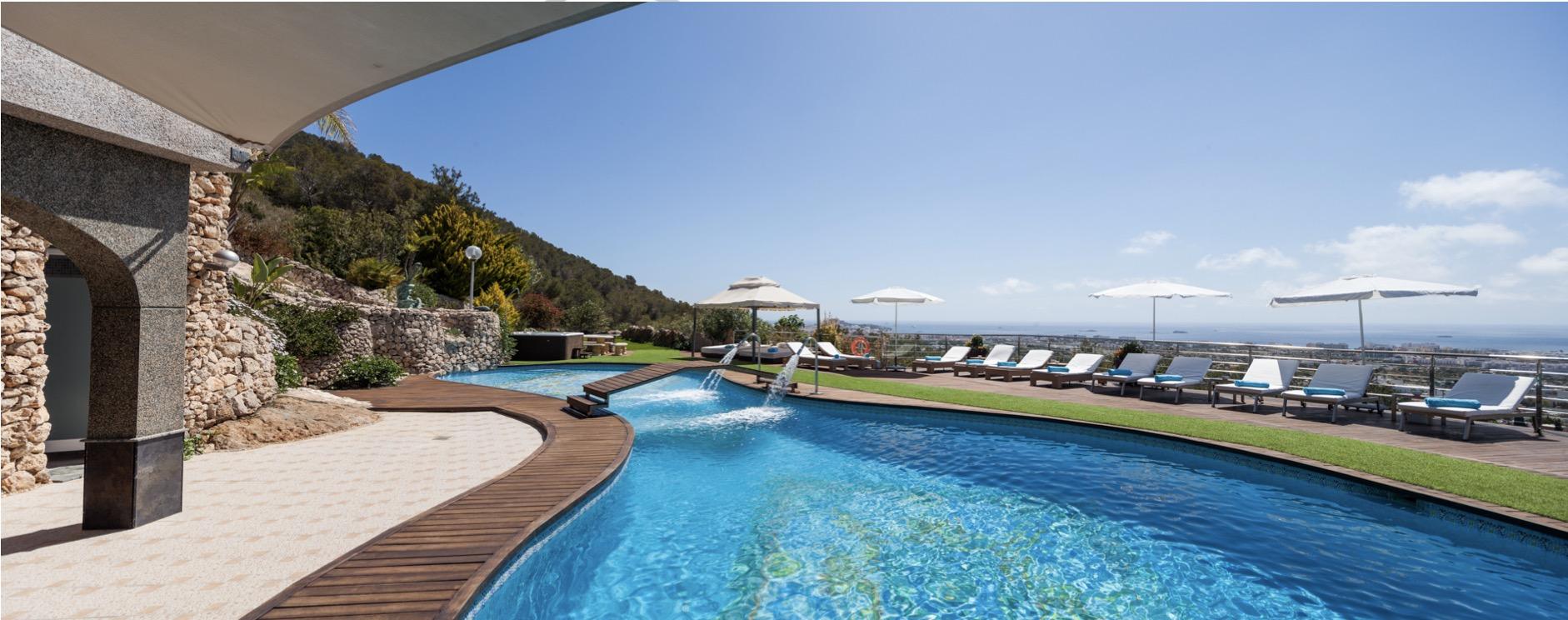 Luxury infinity pool with Mediterranean landscape views in Ibiza