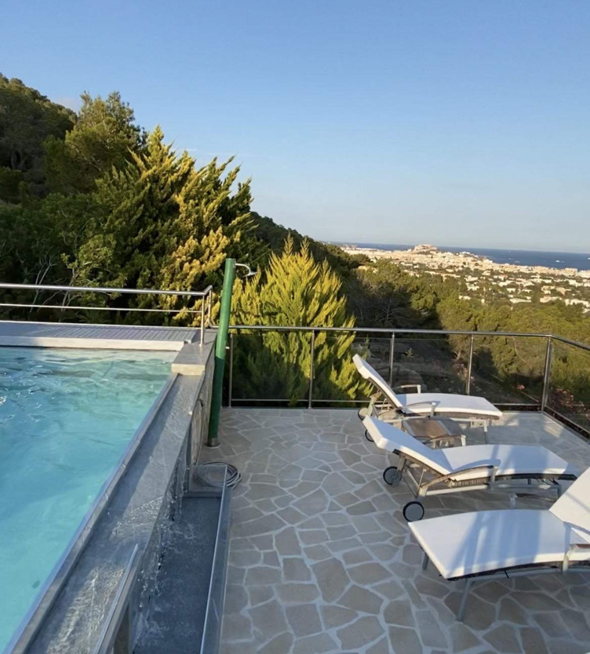 Infinity pool terrace overlooking the Ibiza hills at Villa Tauranga