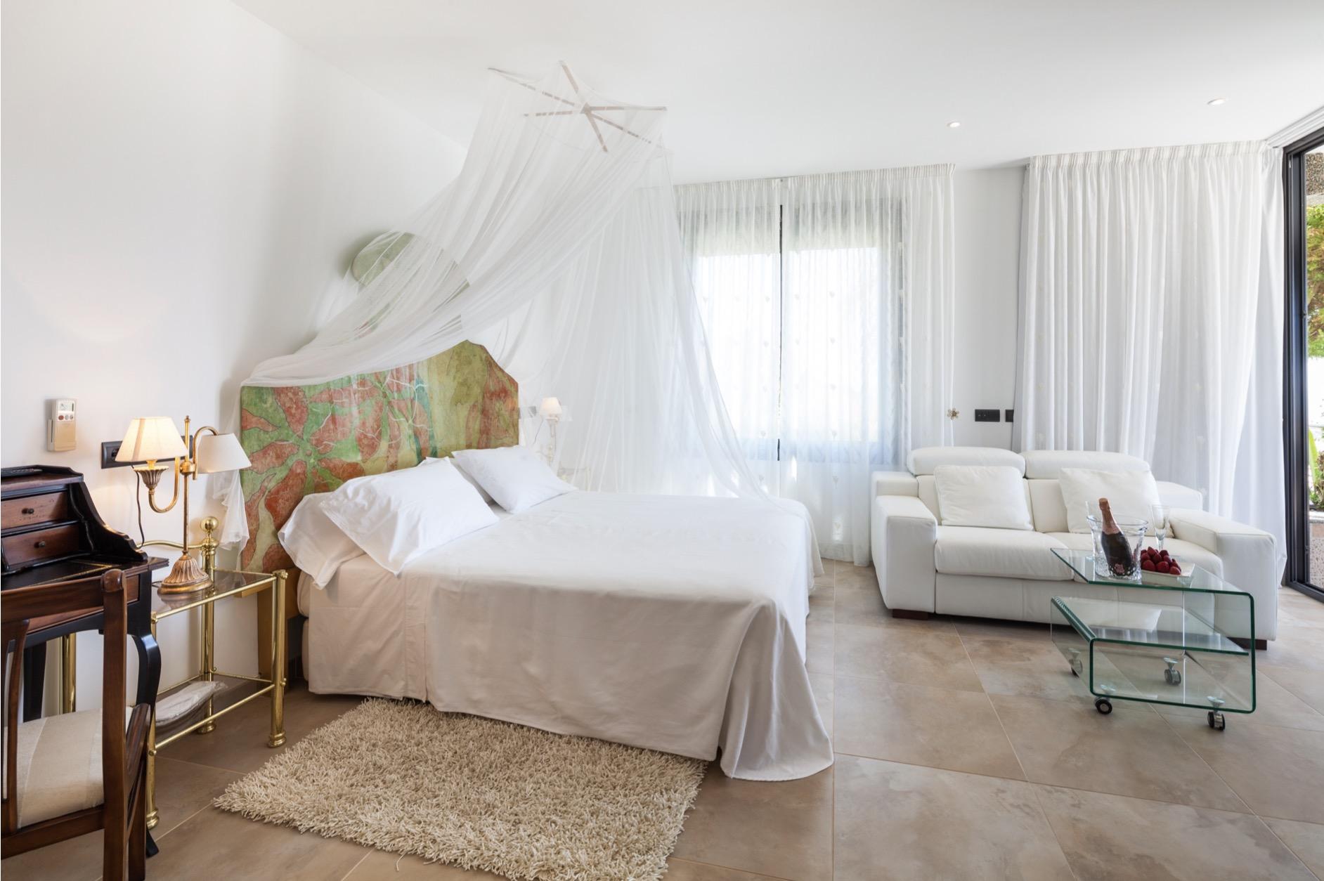 Bright minimalist bedroom with elegant Mediterranean decor at Villa Tauranga