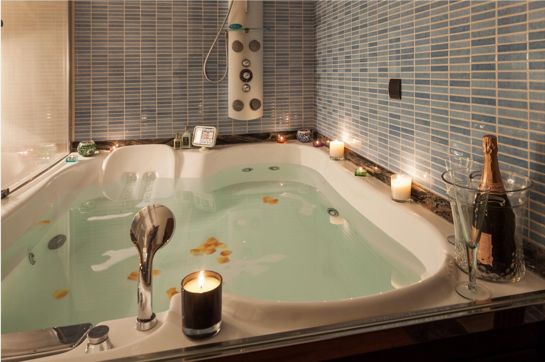 Luxury indoor spa jacuzzi with ambient lighting and relaxation area