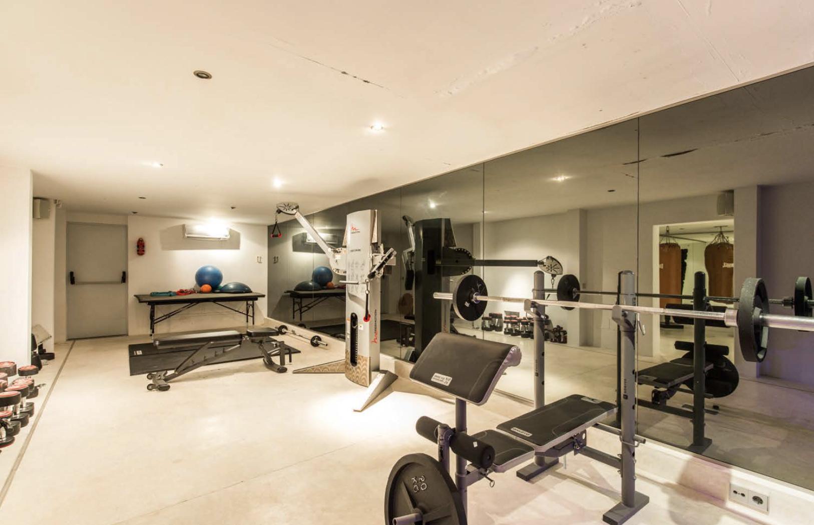 Luxury indoor gym with premium equipment at Villa Oradea