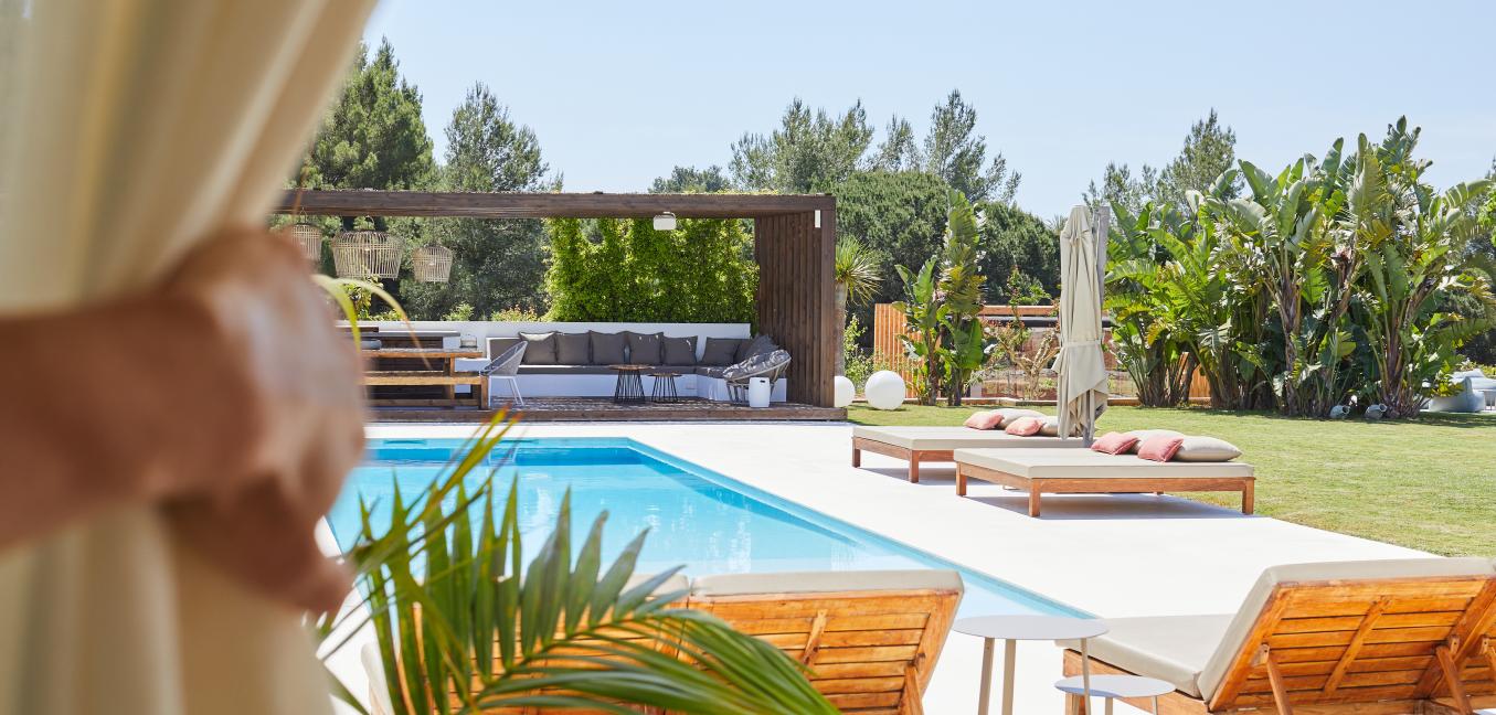 Luxury outdoor pool lounge area at Villa Dossier