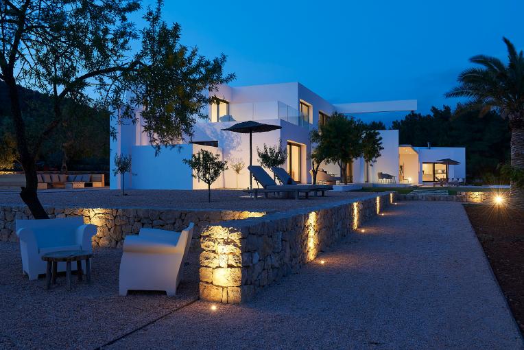 Luxury contemporary villa exterior at sunset in Ibiza
