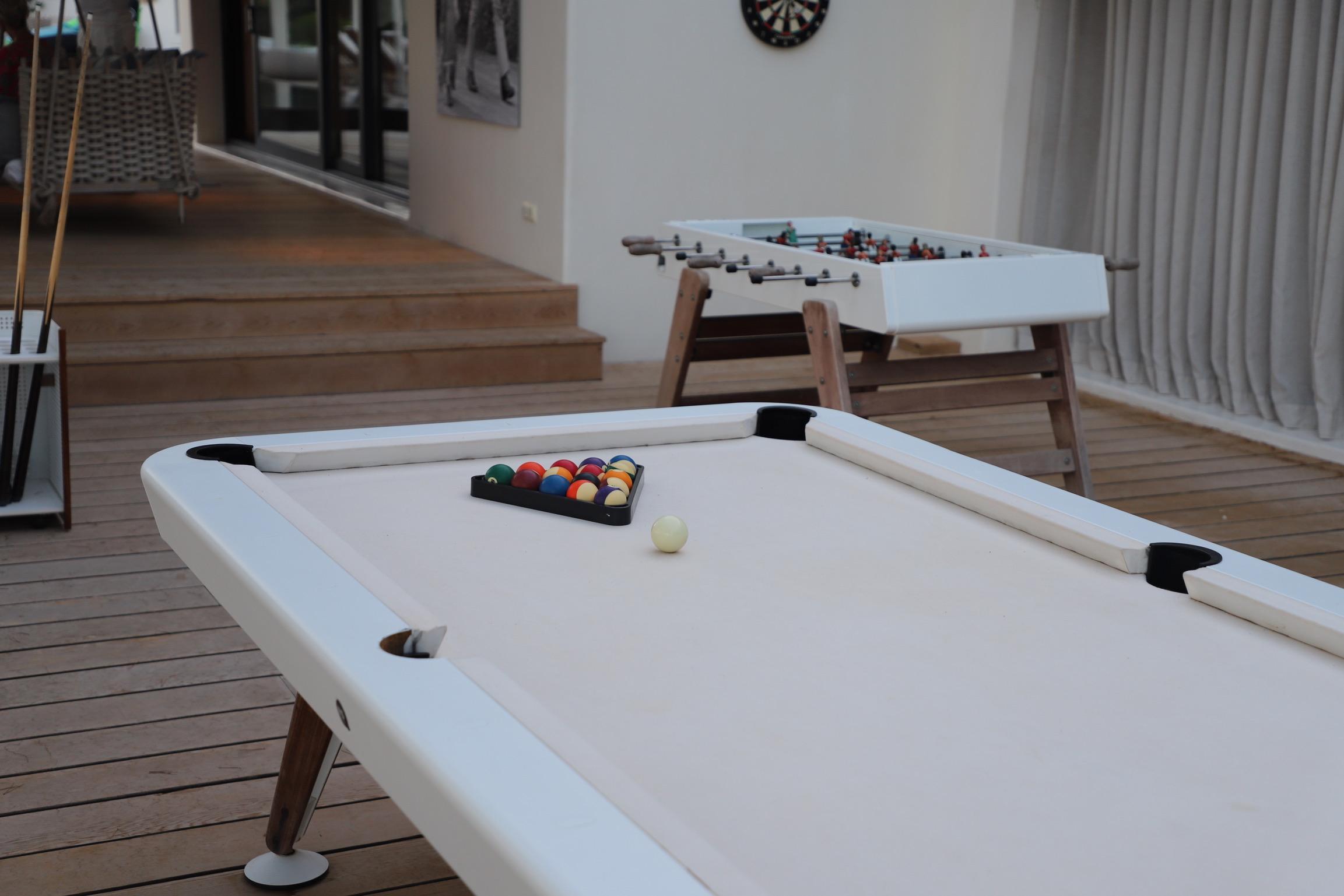 Entertainment room with billiards table inside Casa Alegre villa