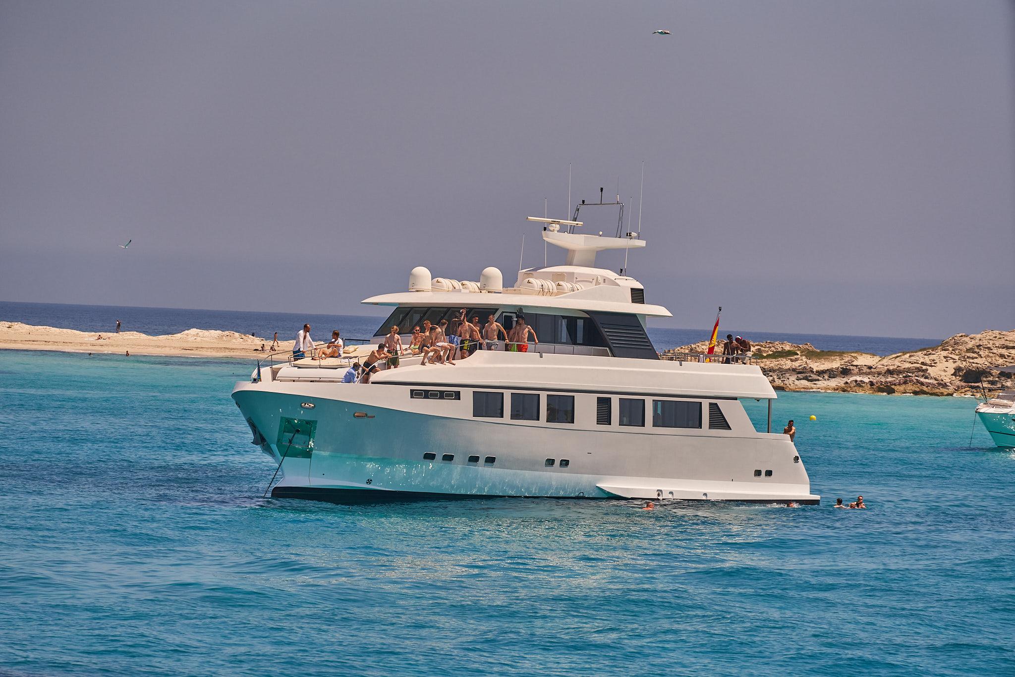 Explorer 92 luxury yacht docked at Ibiza marina during sunset