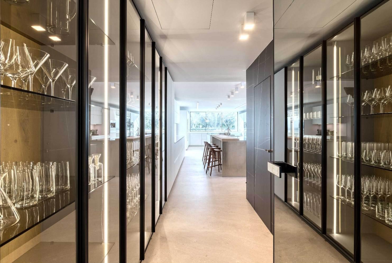Contemporary hallway with floor-to-ceiling glass design