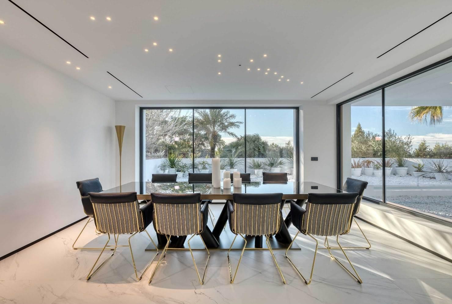 Elegant dining room with panoramic natural light at Villa Forest