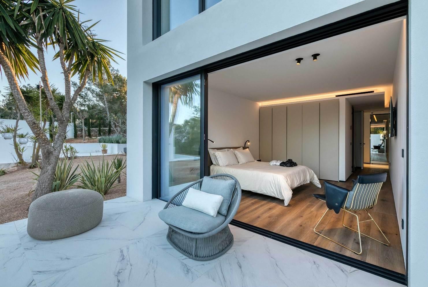Modern suite with terrace access and pool views