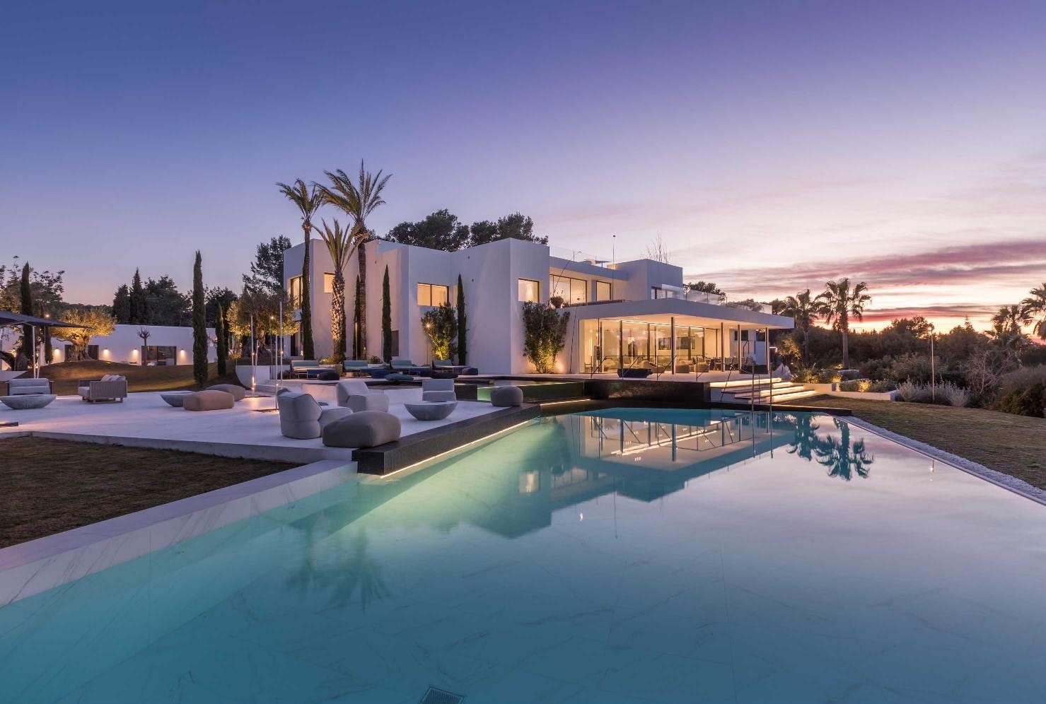 Luxury infinity pool surrounded by modern architecture in Ibiza