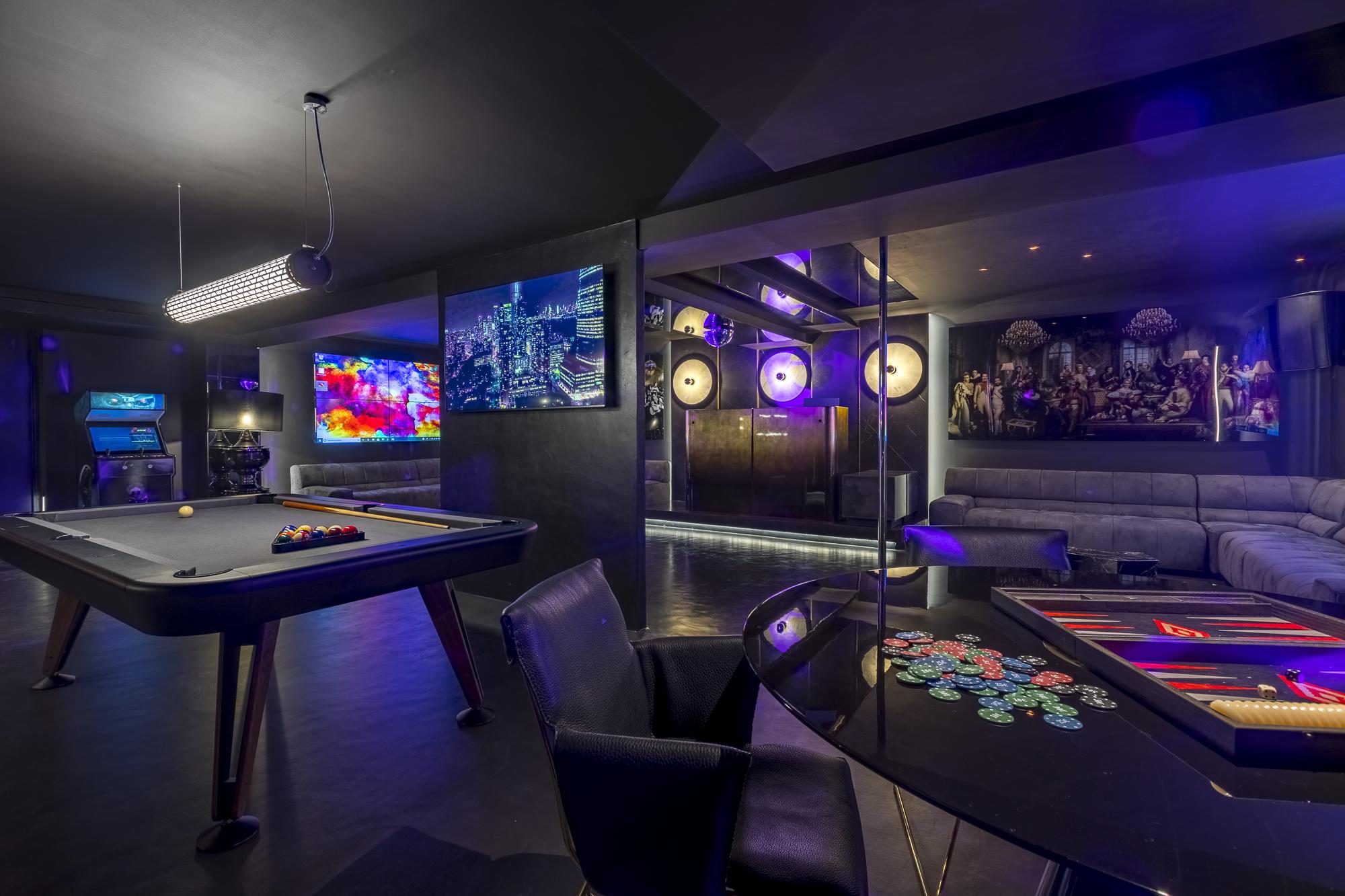 Luxury entertainment room with arcade games and private cinema at Villa Forest Ibiza