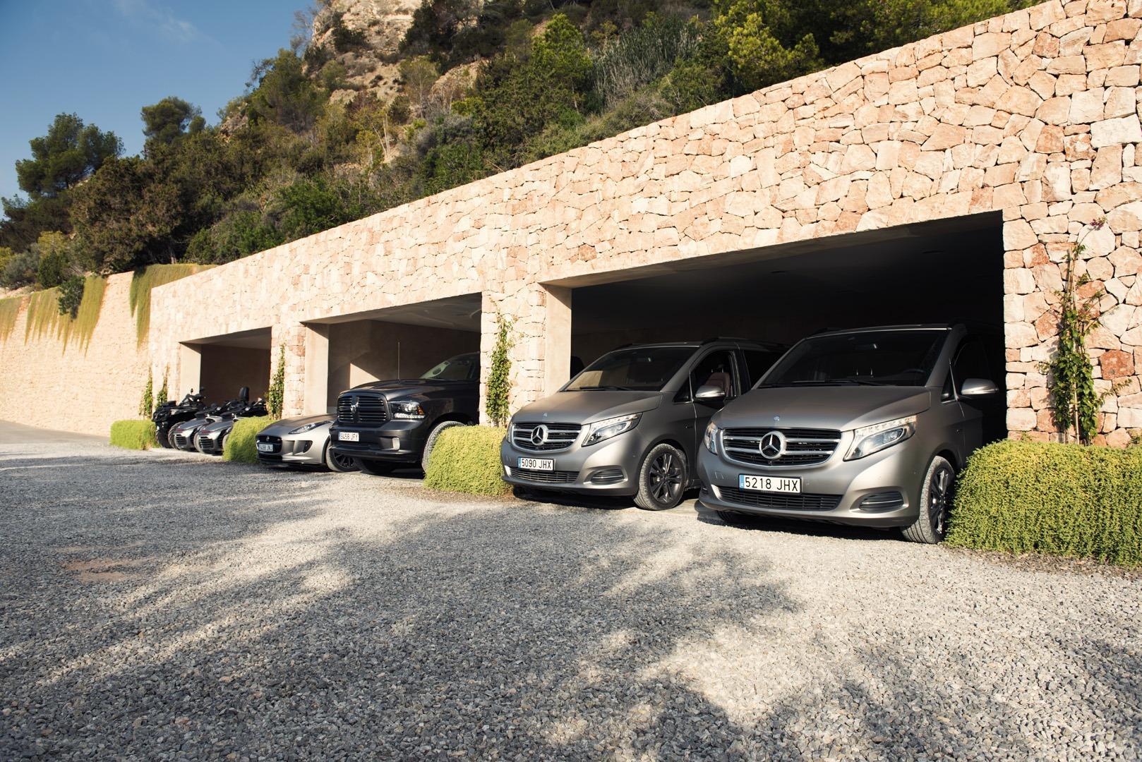 Private parking area with luxury vehicles at Casa Alegre villa Ibiza