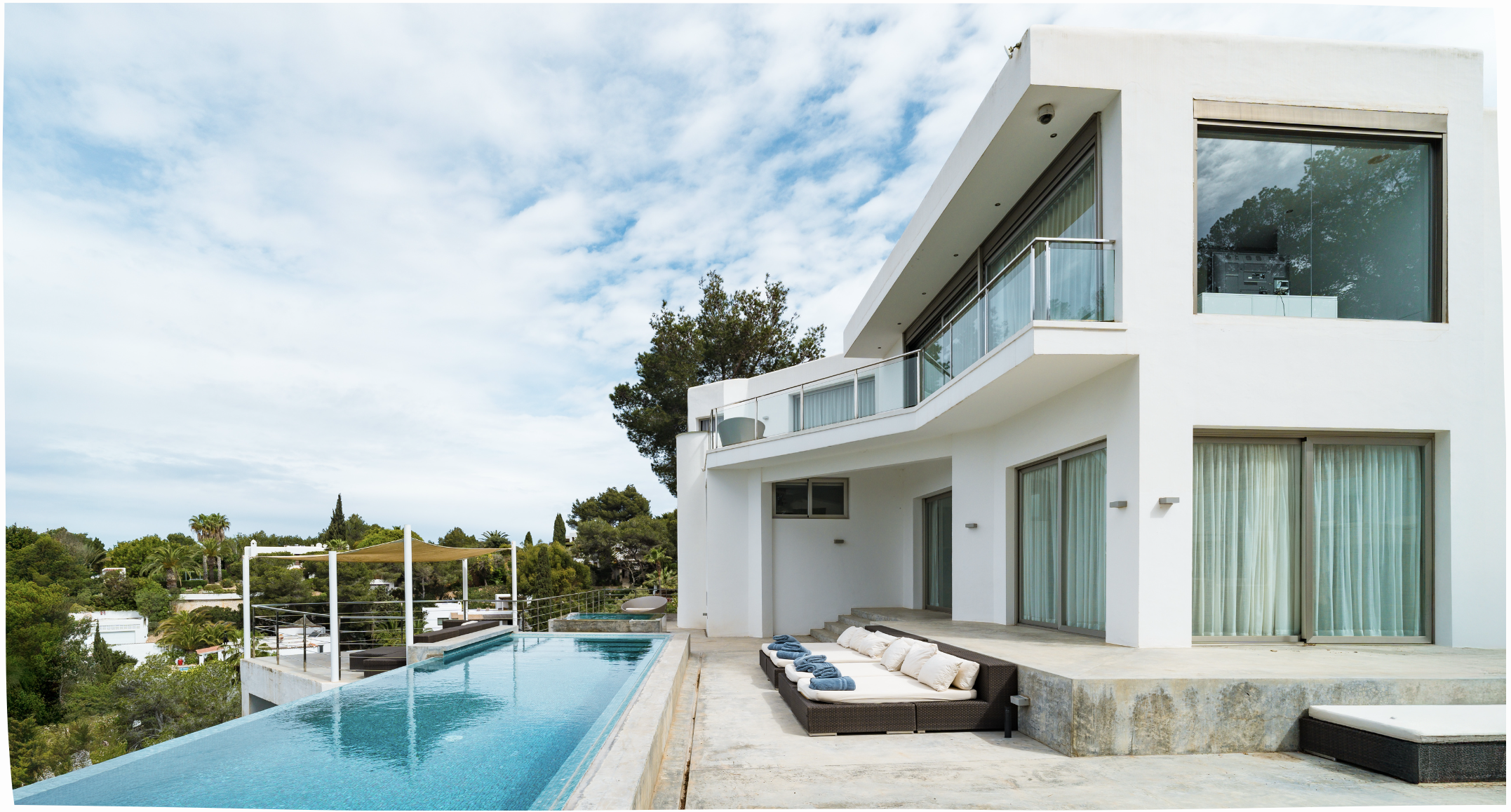 White luxury villa with infinity pool in Ibiza