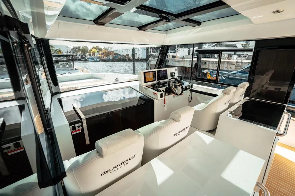 Contemporary interior helm station and lounge inside De Antonio 50 Coupé
