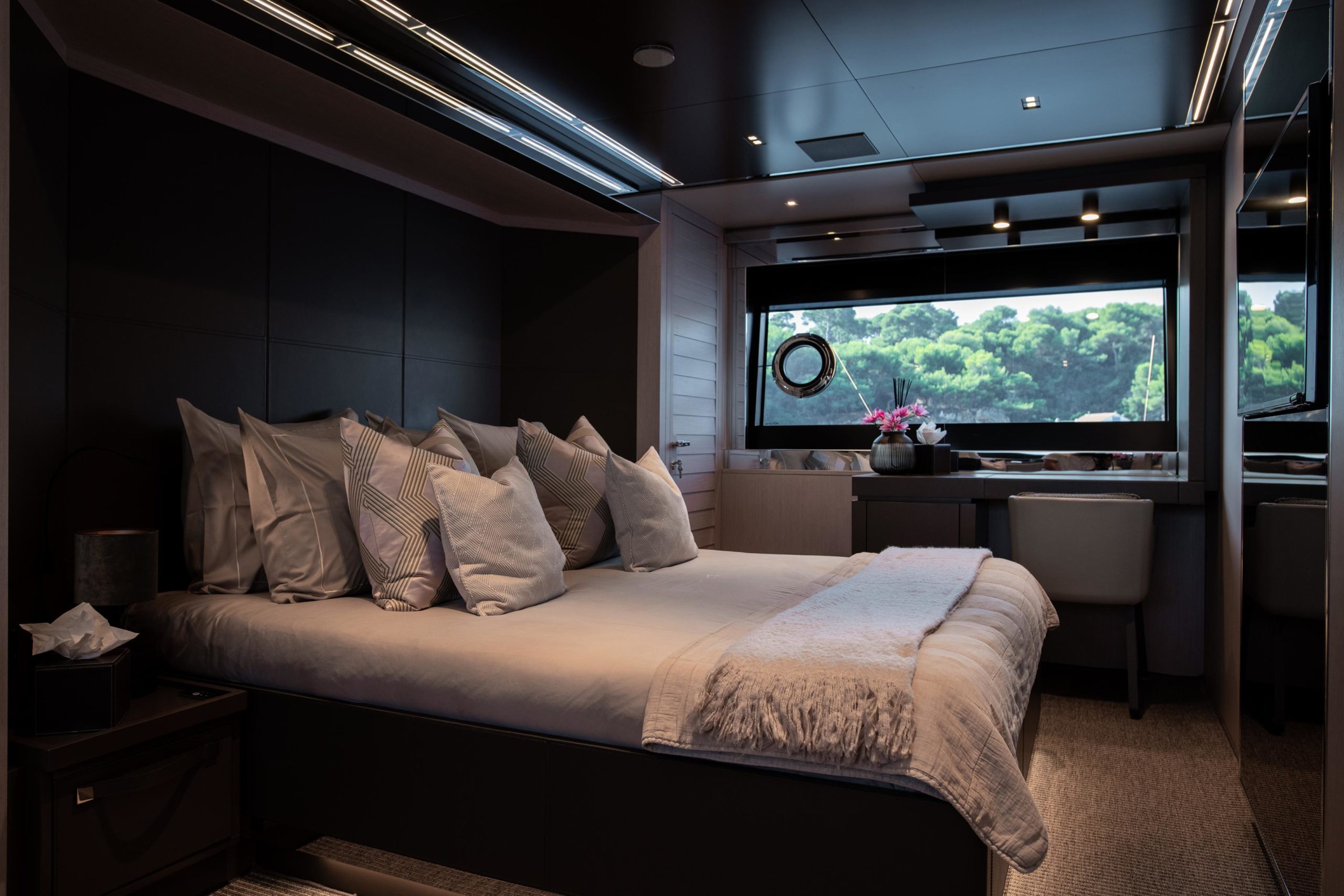Spacious master cabin with panoramic windows aboard Riva Argo 90