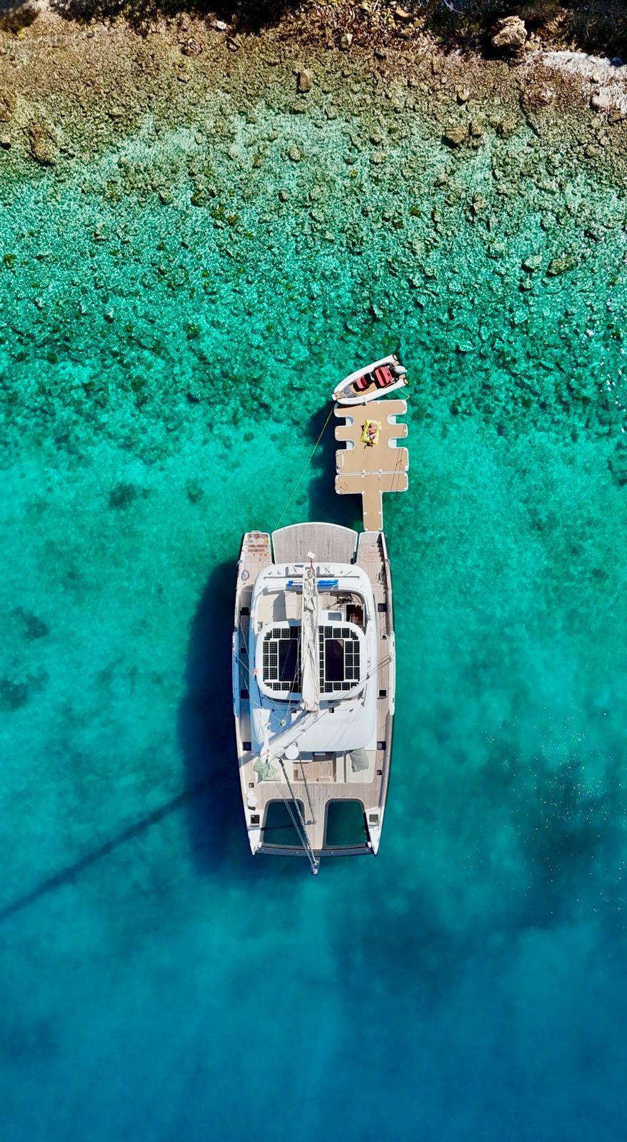 Aerial top view of Sunreef 70+ catamaran in Ibiza