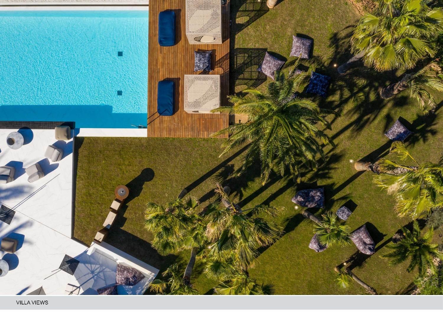 uxury tropical villa and private pool in Tulum surrounded by palm trees and exclusive resort atmosphere